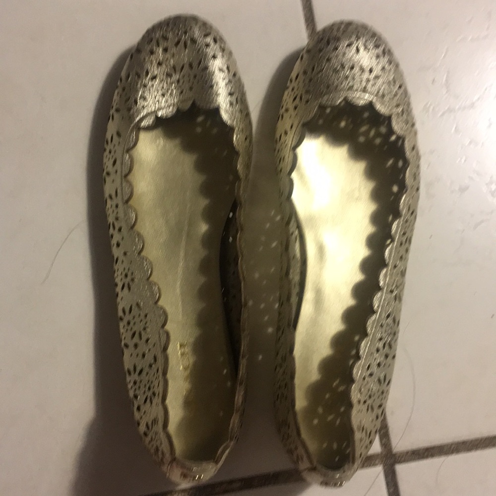 Gold metallic coach flats